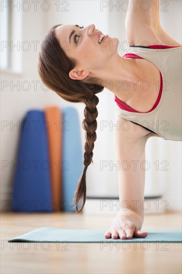 Young woman exercising at home