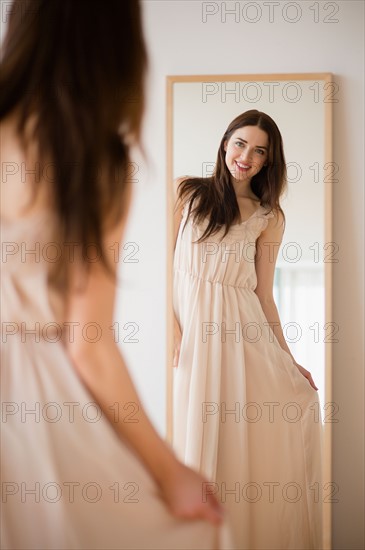 Bride trying on wedding dress