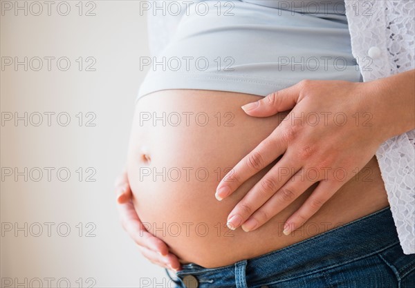 Close-up of pregnant woman's belly