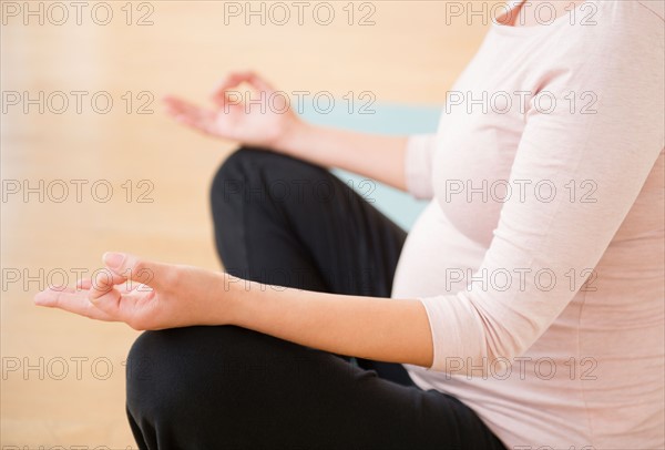 Pregnant woman practicing yoga