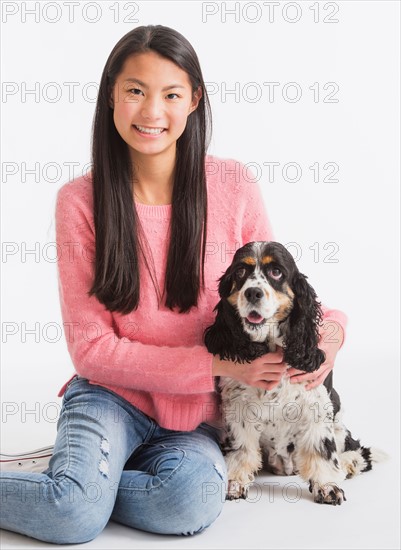 Portrait of teenage girl ( 16-17 years) with dog