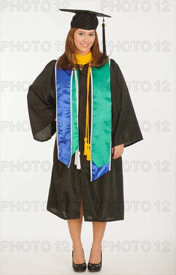 Portrait of graduate student holding diploma