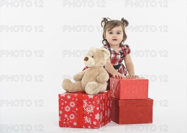 Portrait of Baby girl ( 6-11 months) with gift boxes