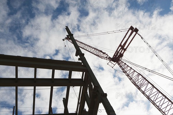 Upward view of crane and construction