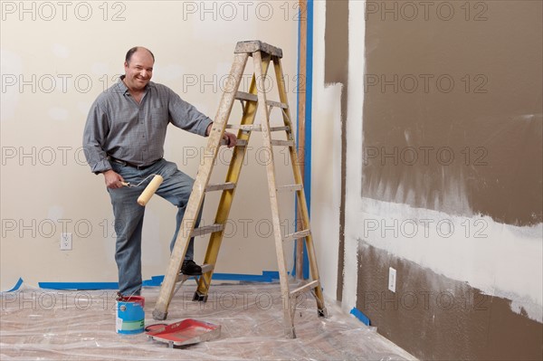 Man painting wall