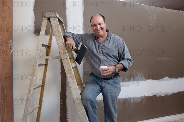 Man painting wall