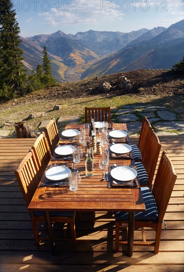 Outdoor table and chairs on wooden terrace