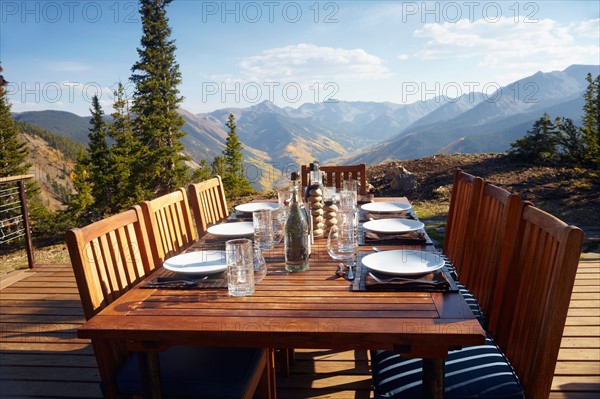 Outdoor table and chairs on wooden terrace