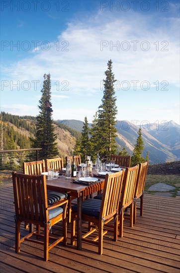Outdoor table and chairs on wooden terrace