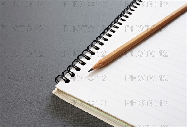 Empty note pad with pencil