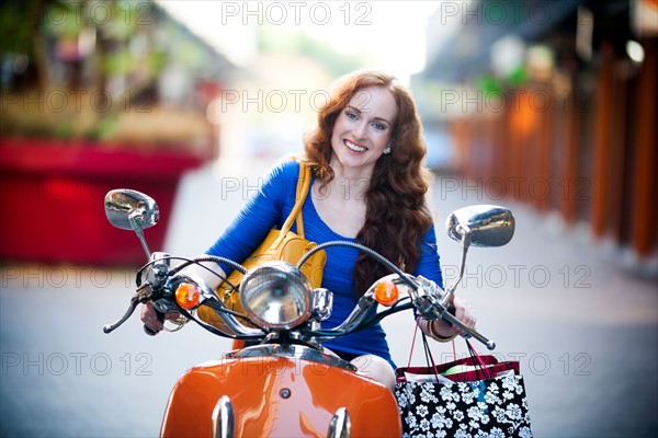 Elegant woman on motorcycle