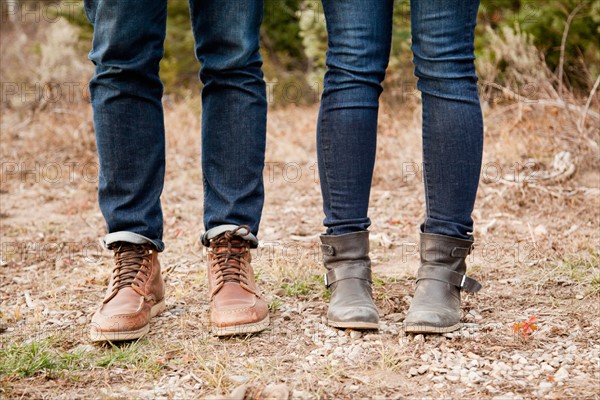 Low section of young people in denim jeans