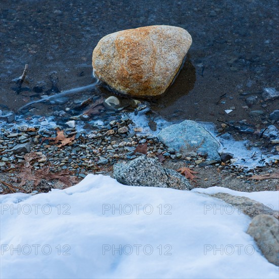 Boulder in water. Walden Pond, Concord, Massachusetts.