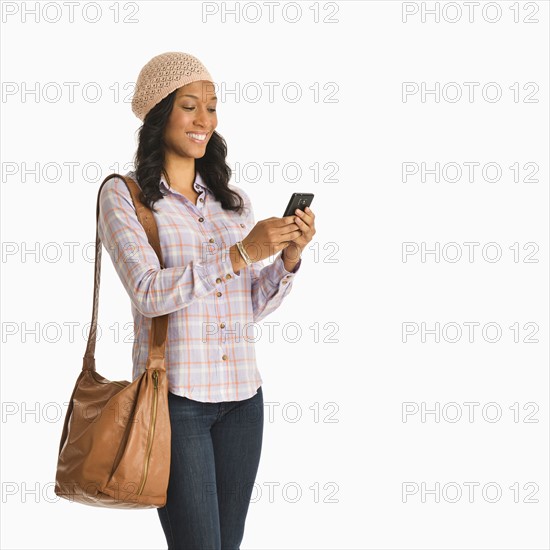 Mid adult woman using phone.