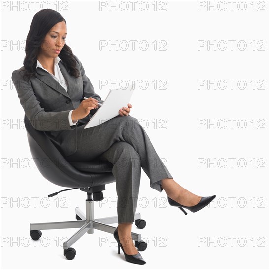 Businesswoman sitting in chair.