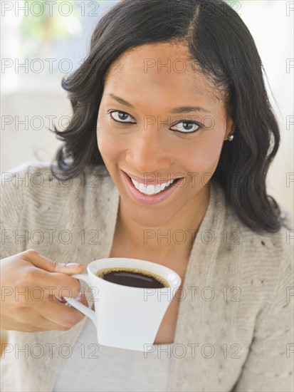 Woman drinking coffee.