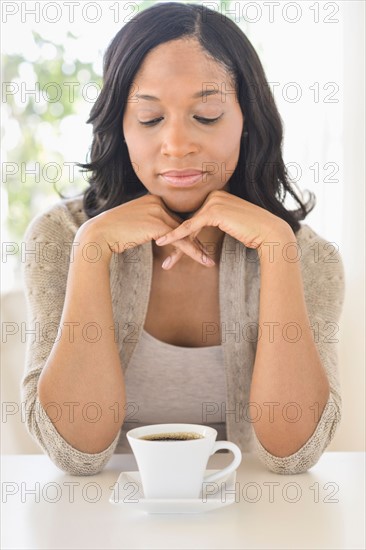Woman drinking coffee.