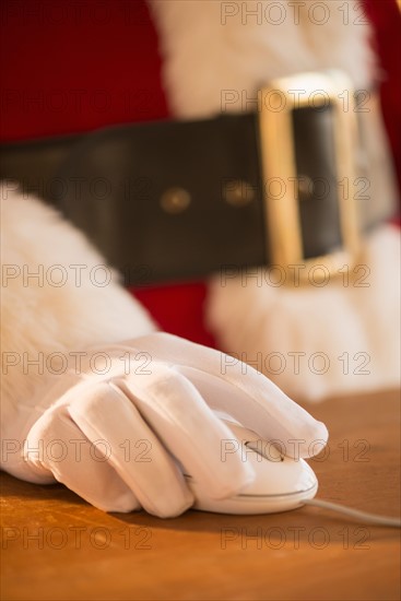 Close-up of santa claus using computer.