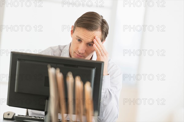 Office worker using computer.