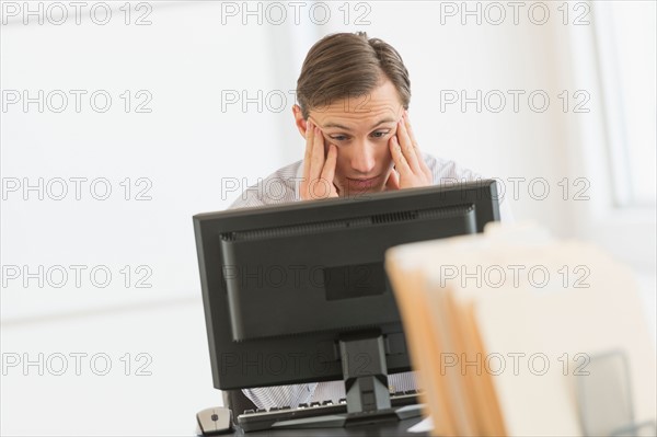 Office worker using computer.