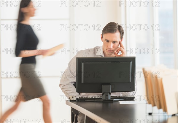 Office worker using computer.