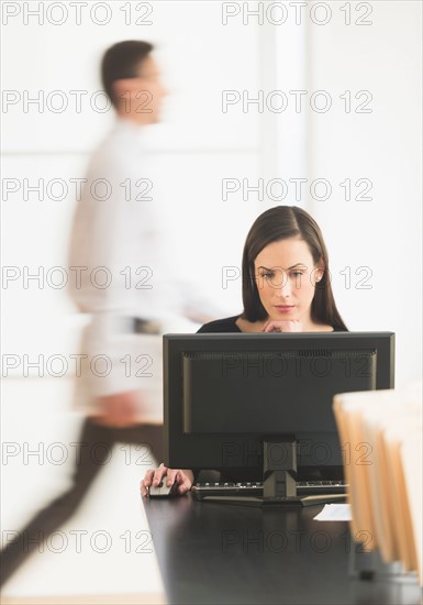 Office worker using computer.