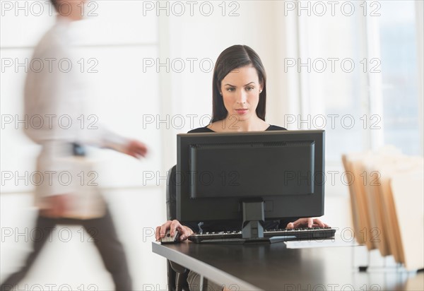 Office worker using computer.