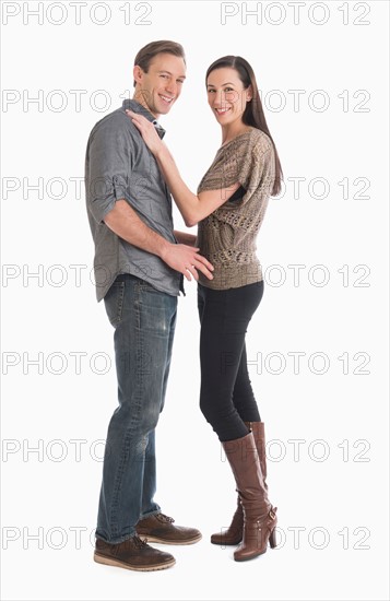 Portrait of couple embracing.