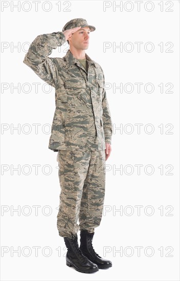 Studio shot of saluting soldier.