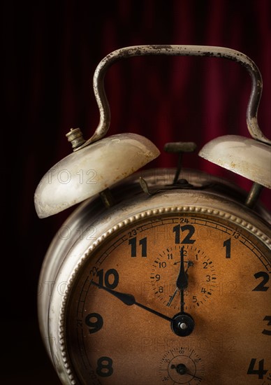 Still life with antique alarm clock.