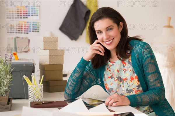 Fashion designer working in studio.