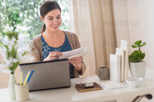 Woman working in home office.