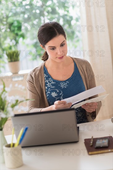 Woman working in home office.