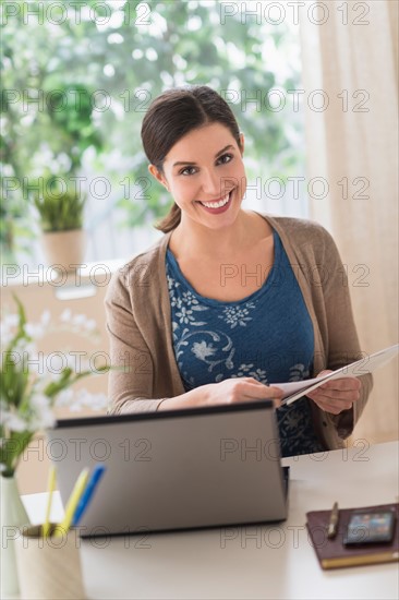 Woman working in home office.