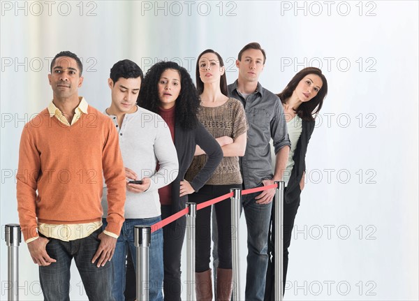 Group of people waiting in line.