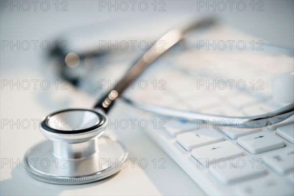 Studio shot of stethoscope and computer keyboard