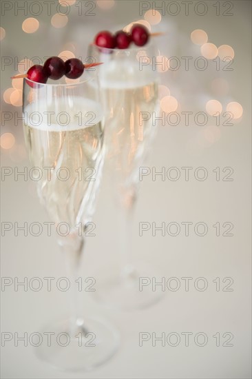 Champagne with cranberry garnish