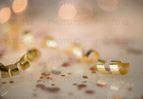 Close-up of gold streamer and confetti