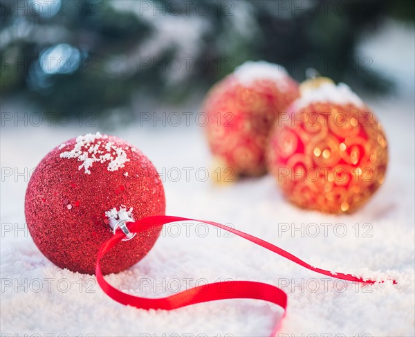 Christmas baubles on snow