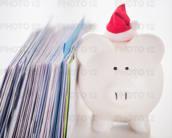 Still life with Santa piggy bank and bills