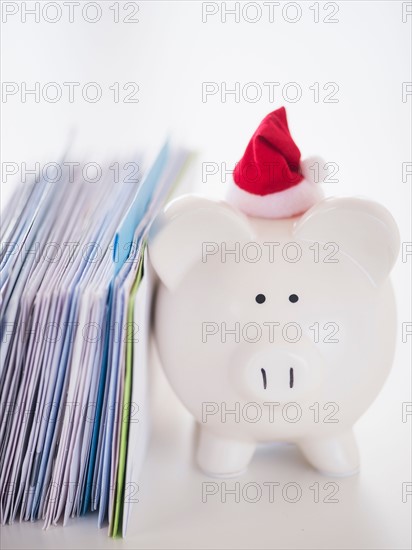 Still life with Santa piggy bank and bills