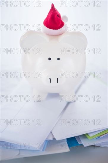 Still life with Santa piggy bank and bills