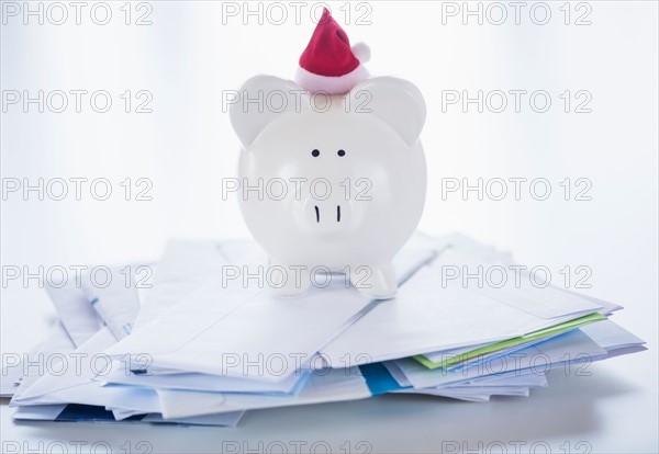 Still life with Santa piggy bank and bills