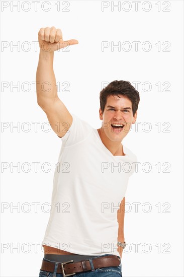 Studio portrait of handsome man cheering