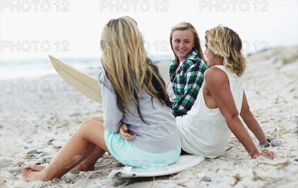 Man and women relaxing on beach