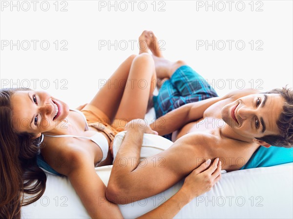 Couple relaxing on sofa together