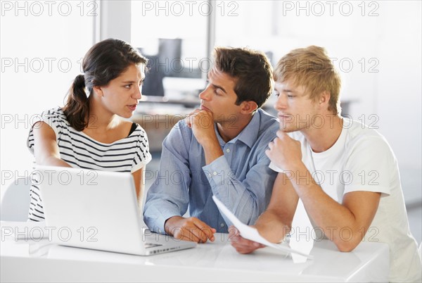 Coworkers discussing at table