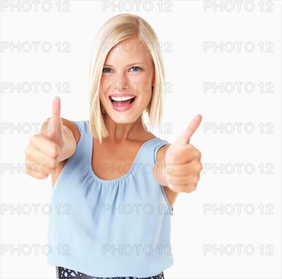 Studio Shot, Portrait of young woman with thumbs up