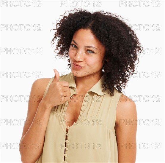 Studio portrait of young woman gesturing