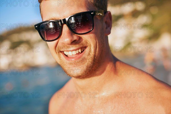 Portrait of young man at beach